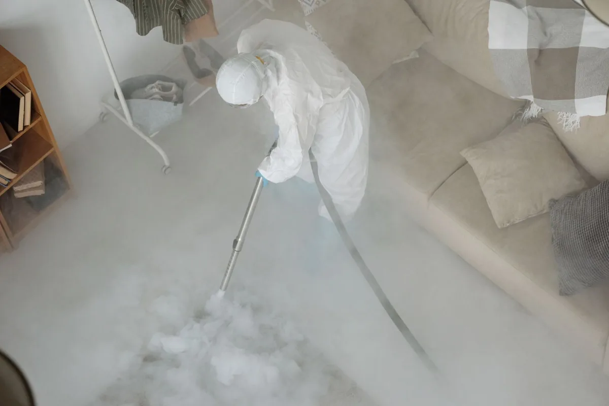Biohazard cleanup technician in protective equipment, Post, TX